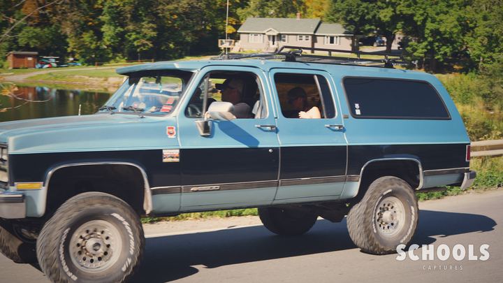 Blue/black two-tone Suburban lifted